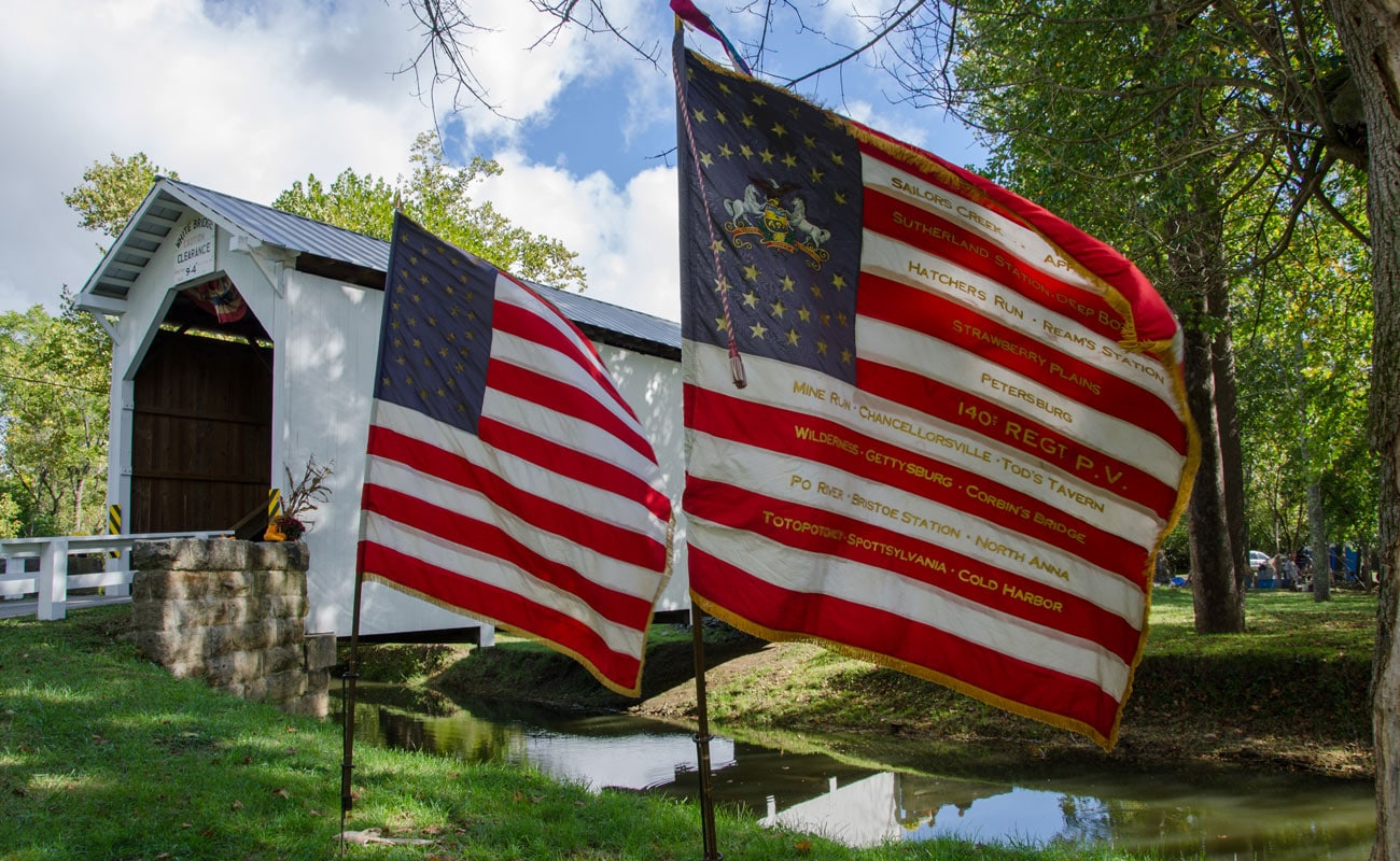 American Flags in front of the White Covered Bridge