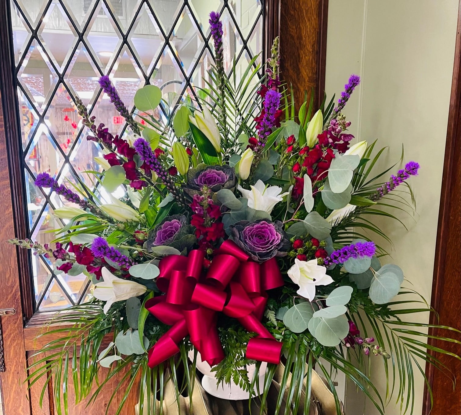 Bouquet of a purple, red, and white floral arrangement.