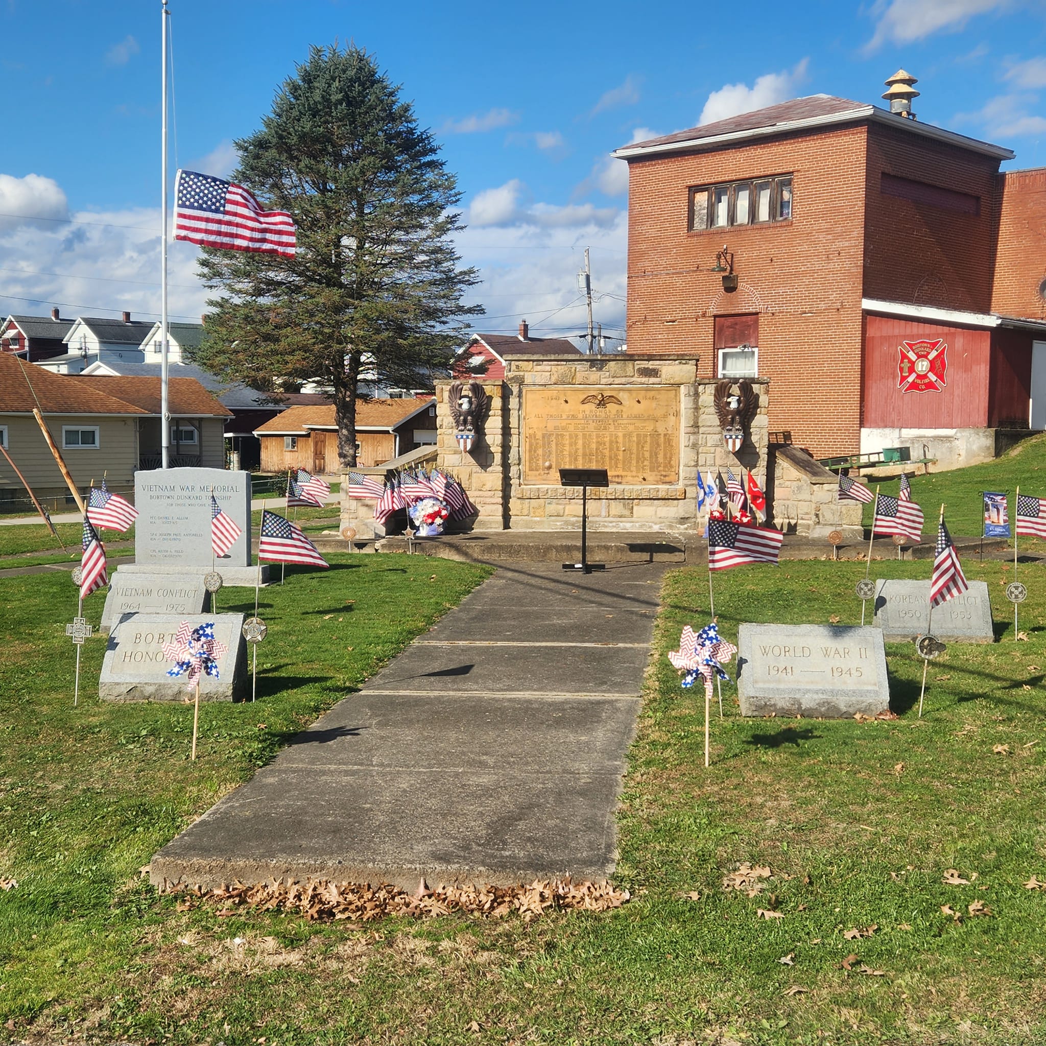 Bobtown Honor Roll with American Flag at half mast.