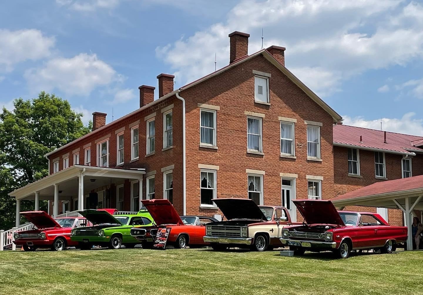 Photograph of car show in front of the Greene County Historical Society Museum.