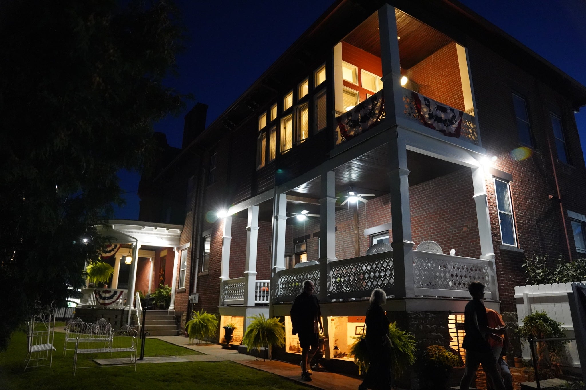 Photograph of the exterior of The Denny House at night.