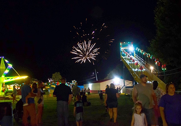 Photograph of fireworks display over the Jacktown Fair midway.