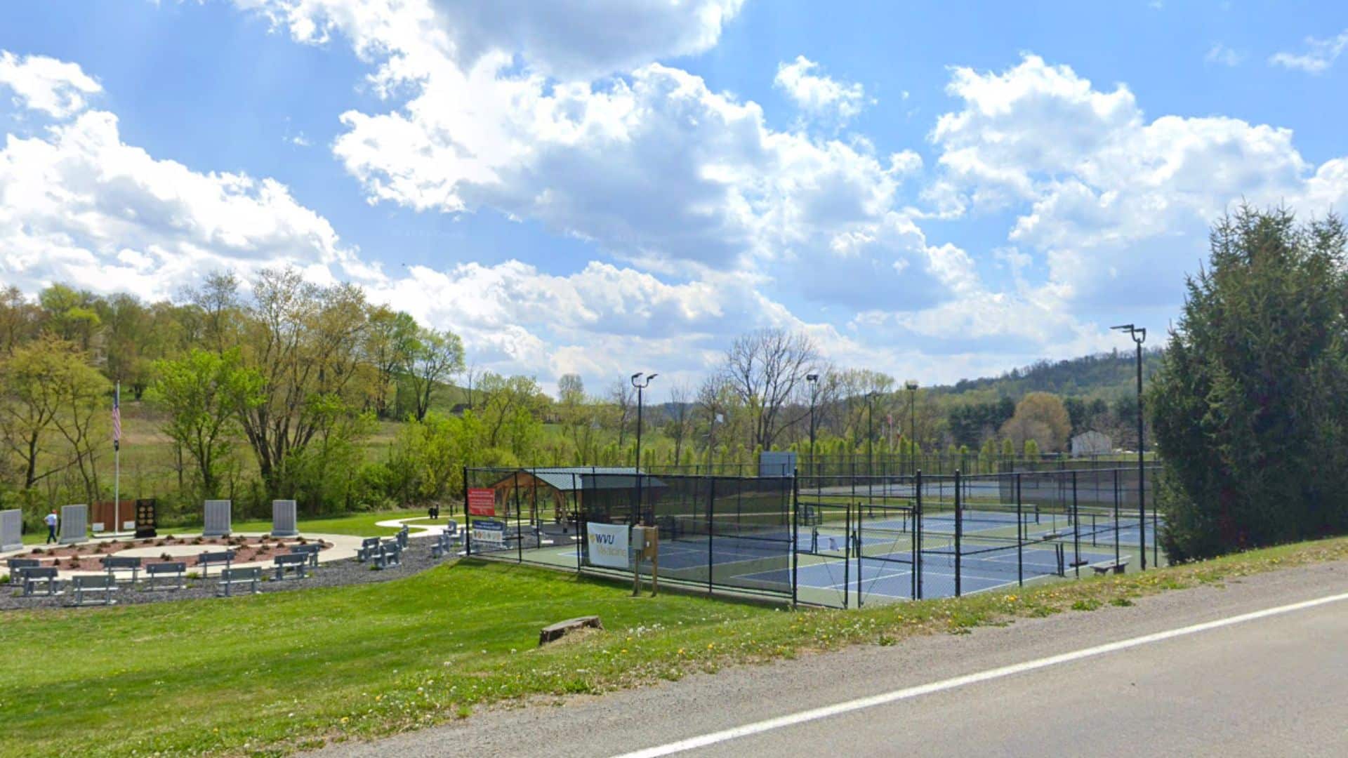 Photograph of landscape with the Pickleball Courts on the right side and the Greene County Veterans Memorial Park on the left.