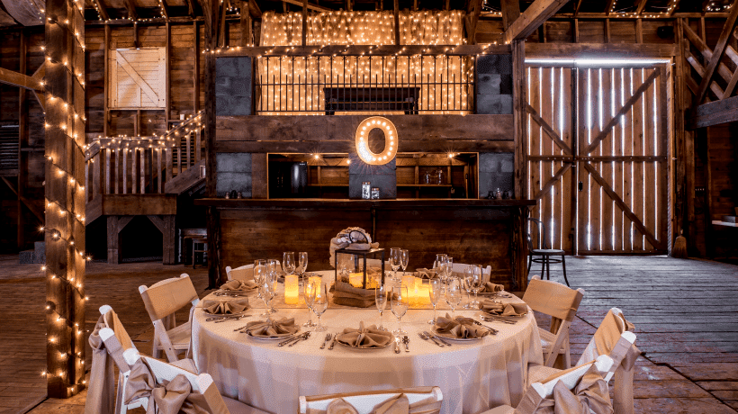 Photograph of a table set-up in front of the bar at Valley View Farm Venue.