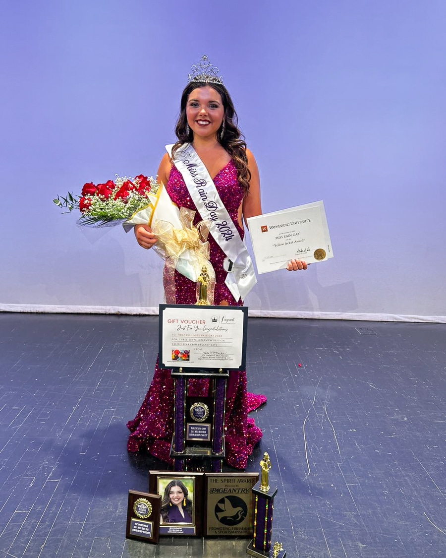 Photograph of 2024 Miss Rain Day Bryn Lahew with awards