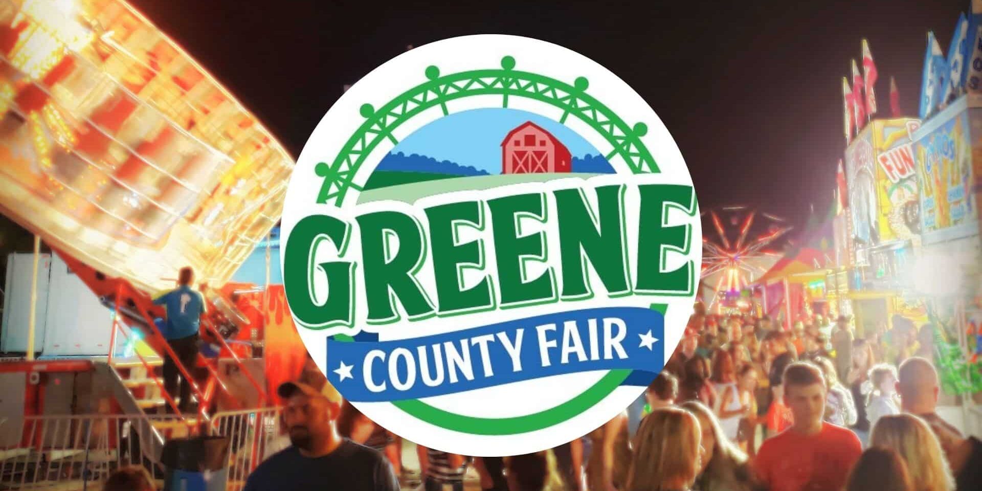 Greene County Fair logo over a nighttime fairground scene with carnival rides, bright lights, and a crowd of attendees.